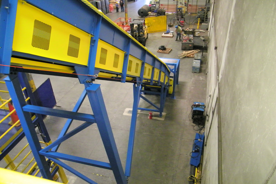 Steel-flight drag chain infeed conveyor installed and feeding the catalytic converter sorting line