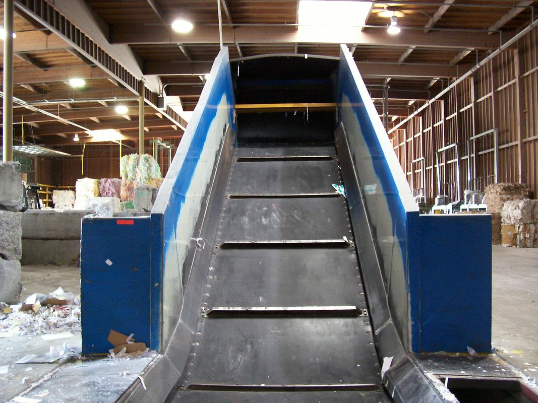 View up the incline of the new elbow-up section added to the drag chain conveyor