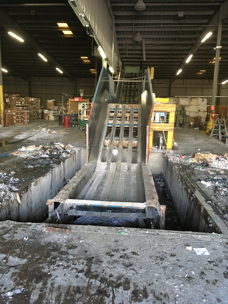 End view of the in-ground conveyor pit with pit plates removed