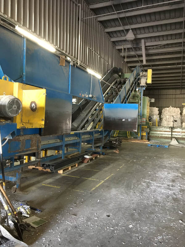 Chain belt feed conveyor with the belt removed for replacement