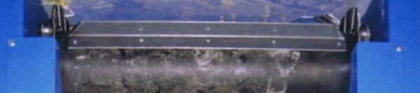 Combination roller chain with rubber belt conveyor, close-up at the sprocket