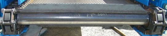 Drag chain conveyor with steel cleat flights, close-up at the sprockets