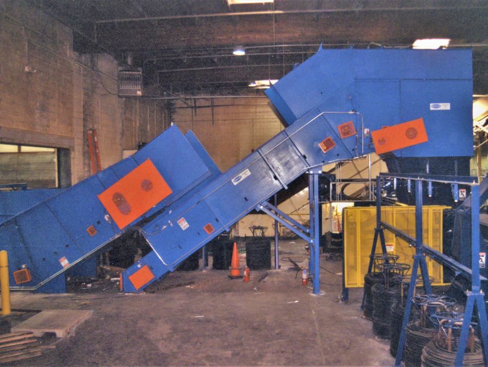 Baler feed conveyor with custom dust control hood