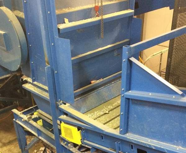 Bypass conveyor positioned under the primary conveyor discharge to feed the secondary baler
