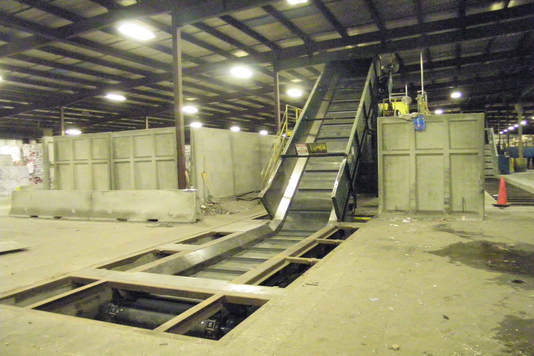 In-ground drag chain with rubber belt conveyor feeding a sorting conveyor