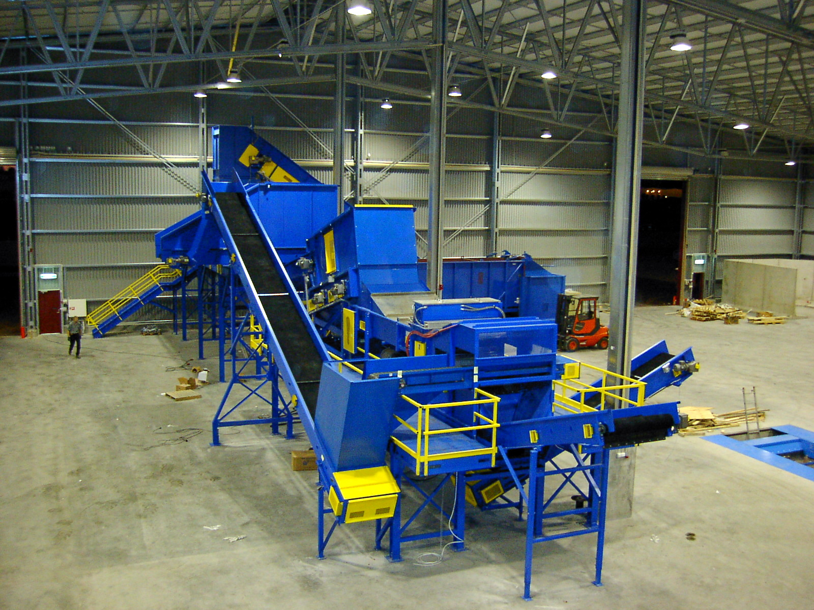 Large Remcon turn-key conveyor and sorting system installed in a recycling facility