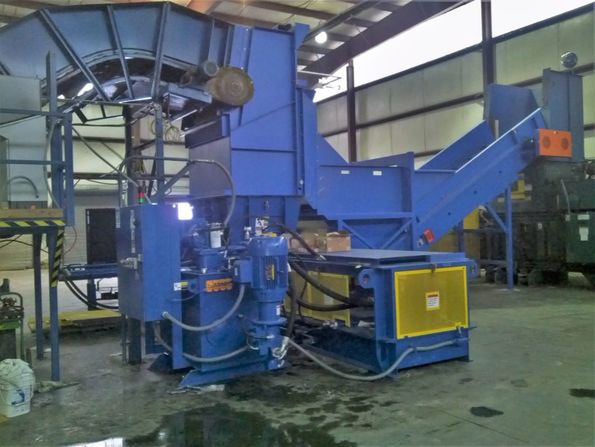 Custom baler feed conveyor hood with two-way redirection chute