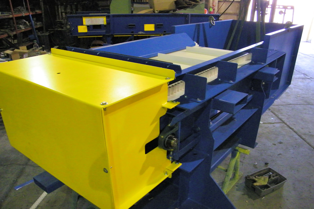 Remcon eddy current separator conveyor with cleated urethane belt for aluminum can recovery, in the fabrication shop