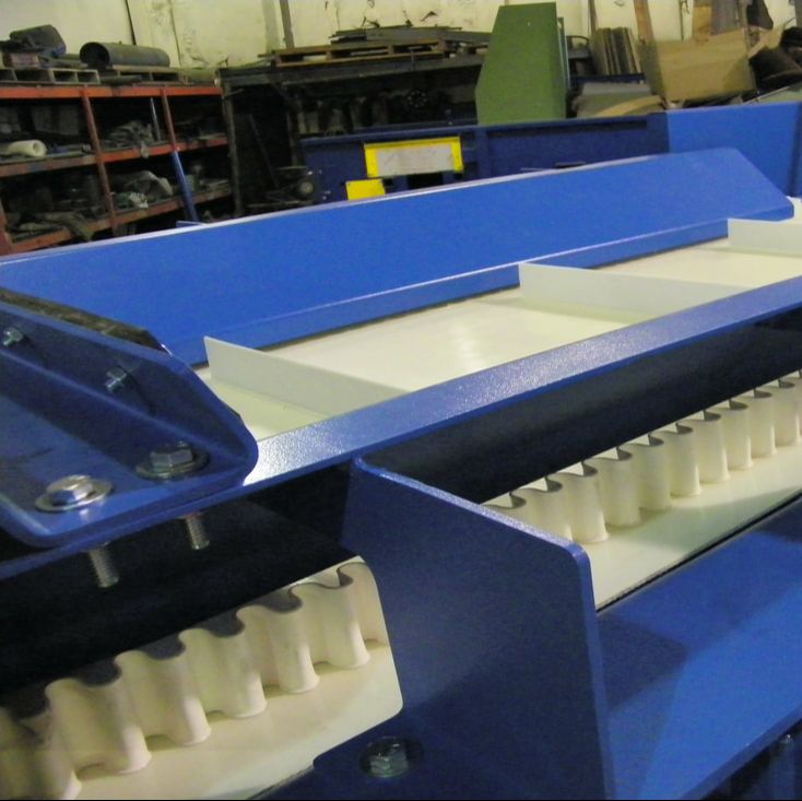 Remcon eddy current separator conveyor for aluminum separation, viewed from the discharge end