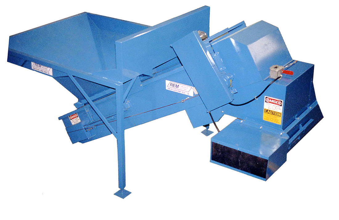 Extra-short Remcon infeed conveyor with infeed hopper and discharge hood feeding a sort conveyor