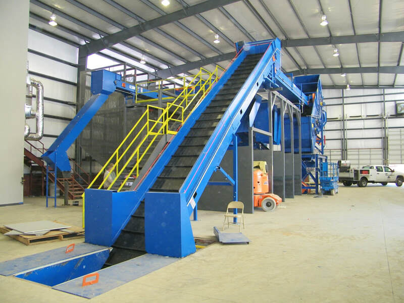 Remcon infeed conveyor with in-ground loading pit, slider bed with rubber belt