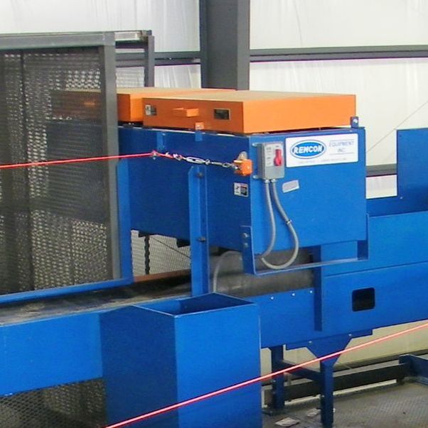 Remcon overhead magnetic separator mounted above a sort conveyor