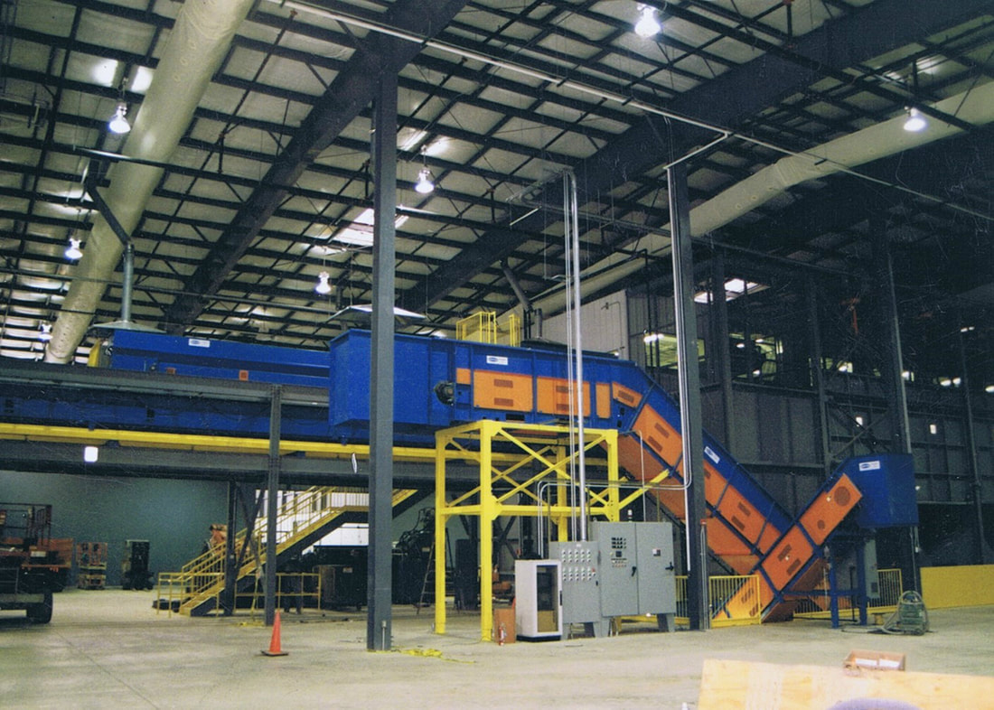 Roller chain conveyor with custom baler hood and extended horizontal section after the nose-over