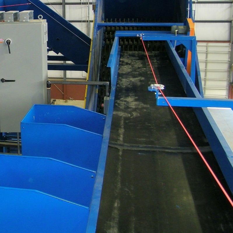 Sort conveyor with drop chutes and pitch hoppers