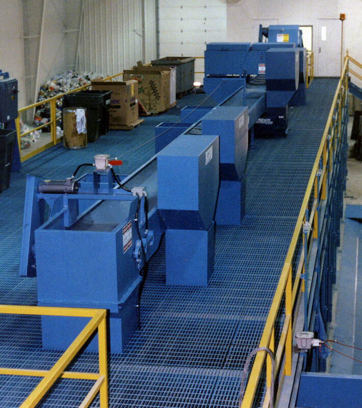 Sort conveyor with pitch hoppers and drop chutes built for sorter ergonomics