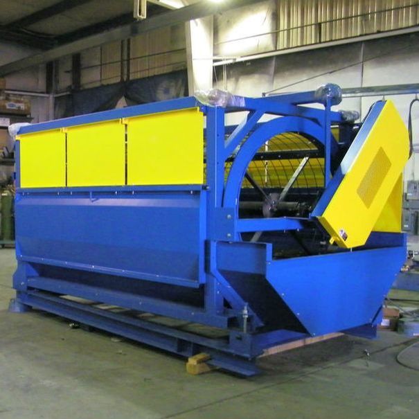 Remcon rotating drum trommel screen with guarded enclosure and collection hopper, in the fabrication shop