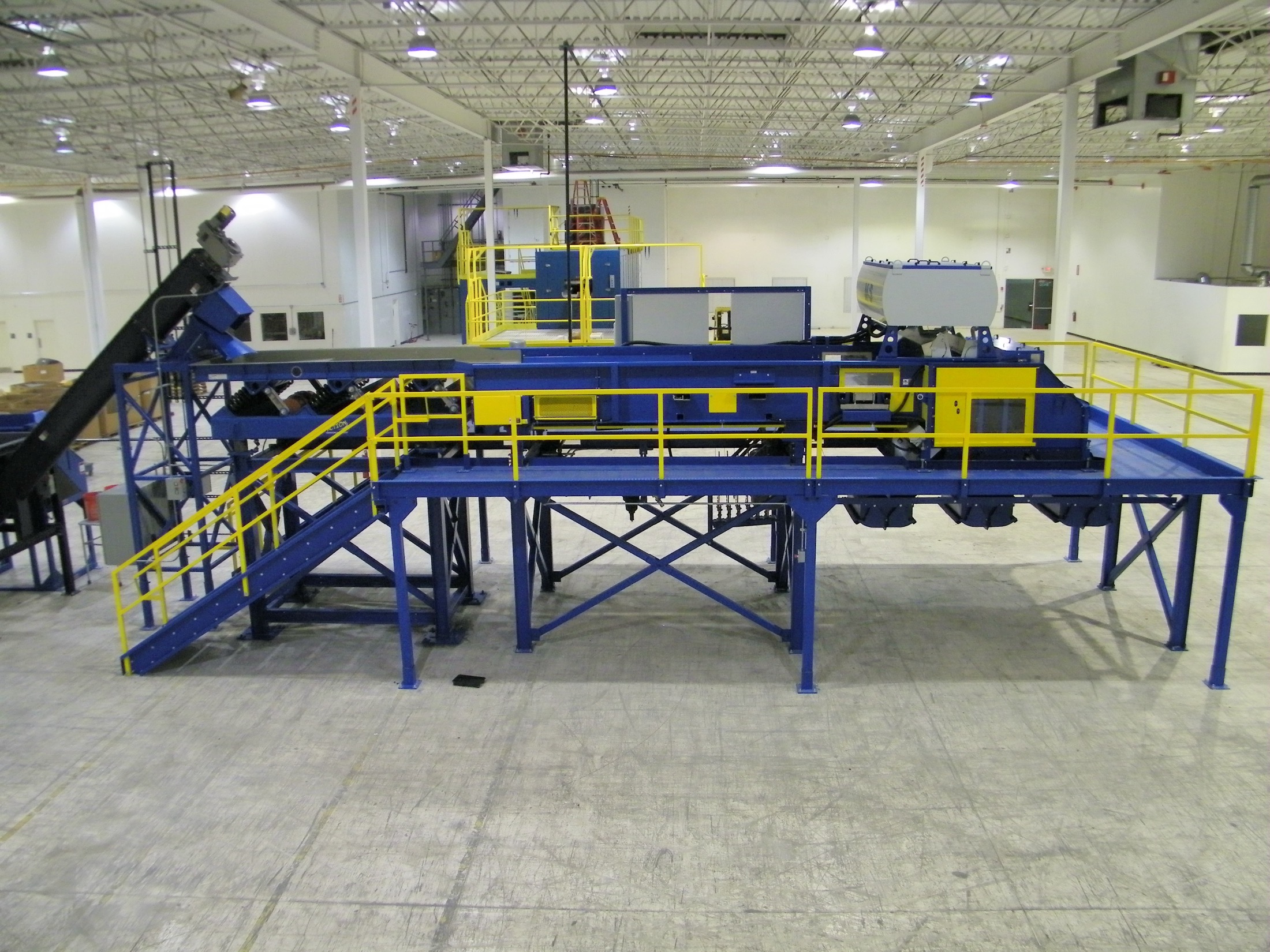 Turn-key sort system with full sorting platform, pitch hoppers, and eddy current separator
