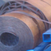 Rolls of replacement conveyor belting staged for a job