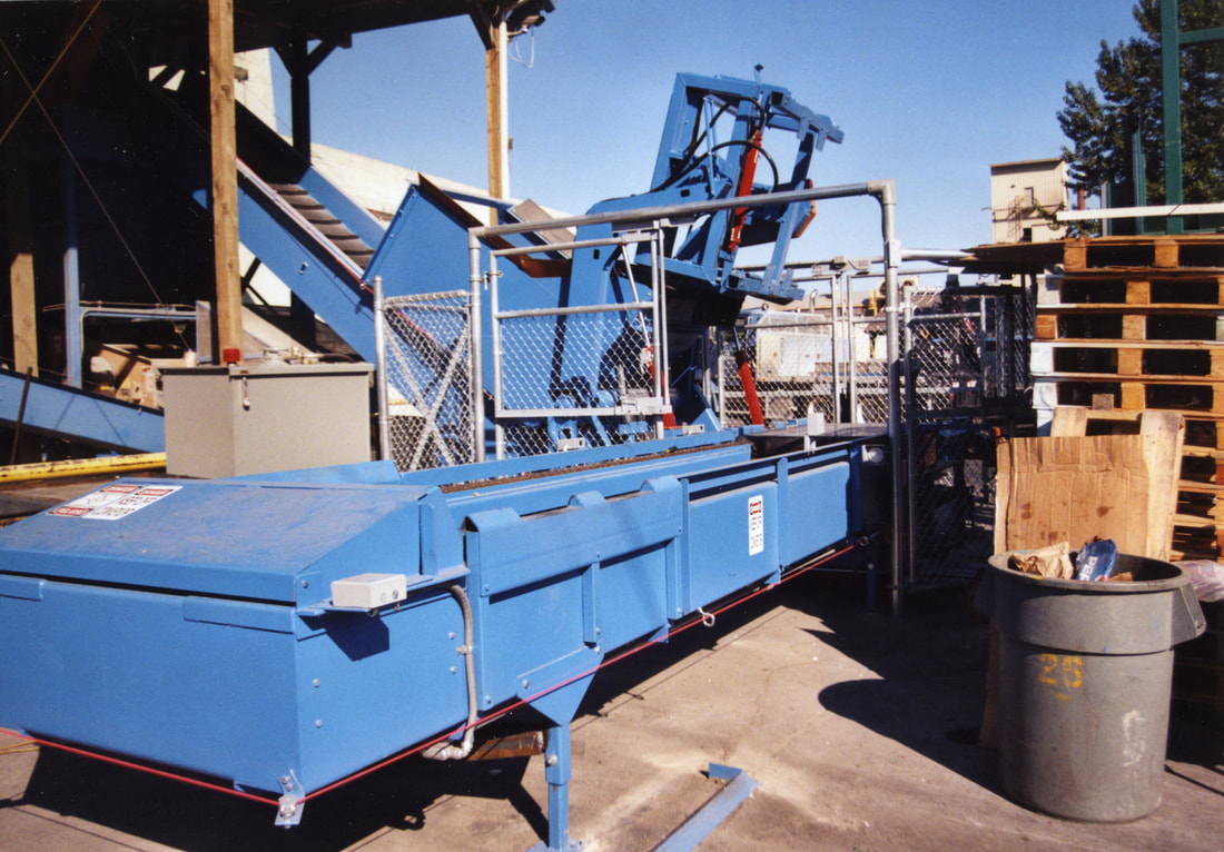 Tote bin conveyor and dumping system built for broken glass