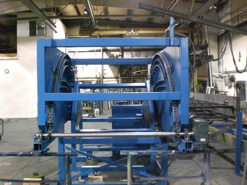 Custom chain-driven tote dumper with enclosed steel housing