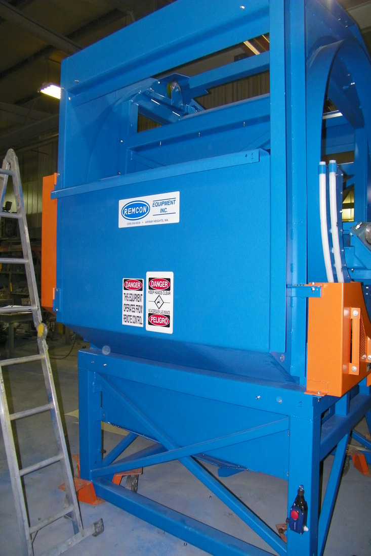 Tote dumper and transfer conveyor viewed from the infeed side